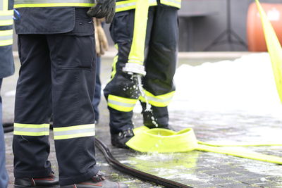 Low section of firefighters working outdoors