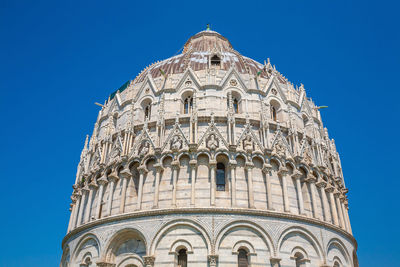 Low angle view of building against blue sky