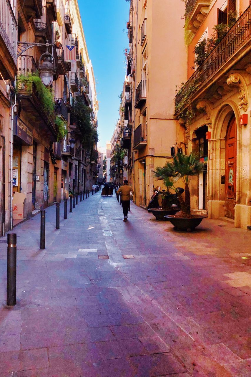 ROAD AMIDST BUILDINGS IN TOWN