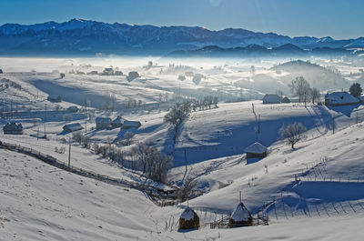 High angle view of snow covered landscape against sky