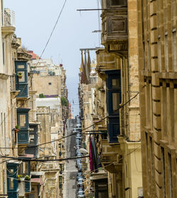 Low angle view of buildings in city against sky