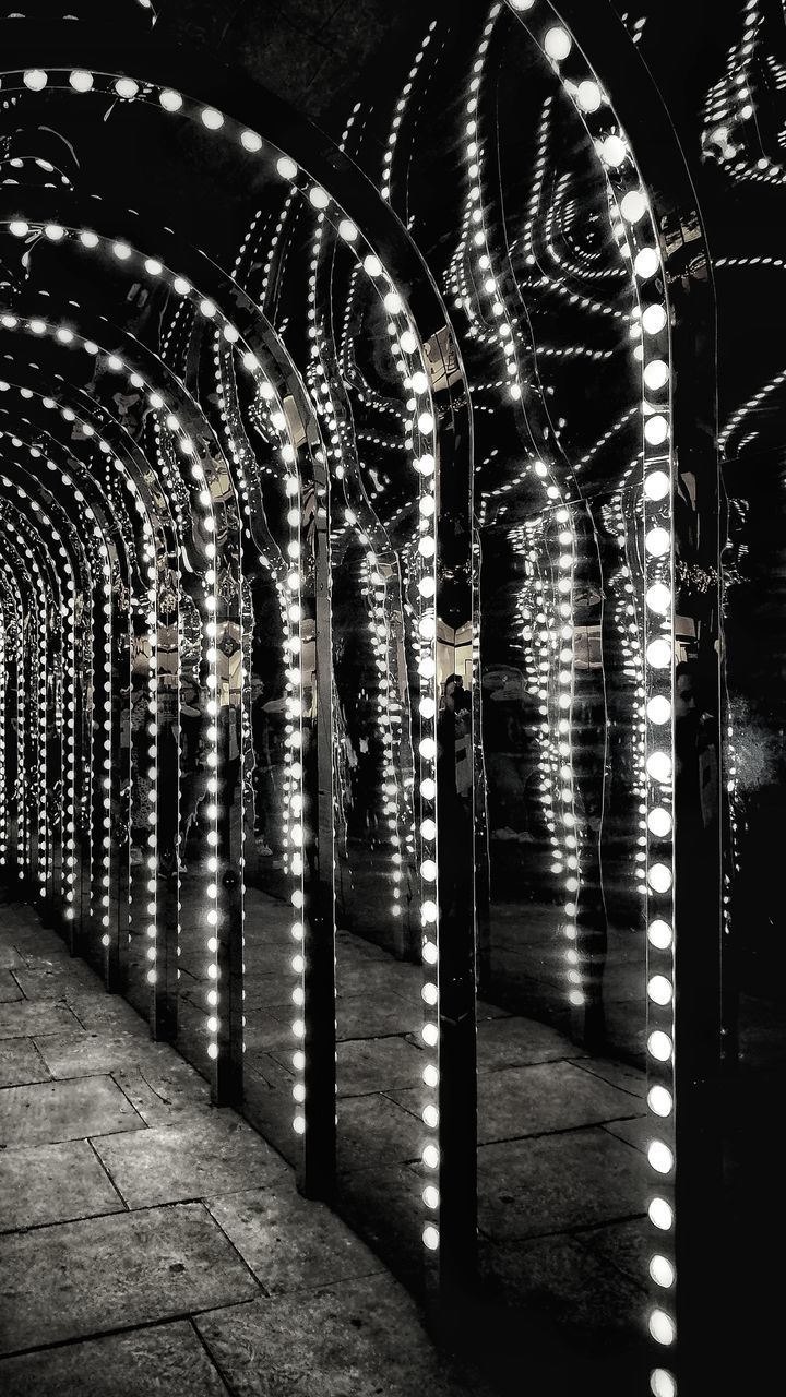 ILLUMINATED LIGHTS ON GLASS BUILDING