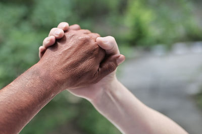 Close-up of hand holding hands