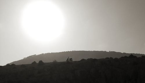 Scenic view of silhouette mountain against sky