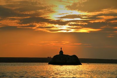 Scenic view of sea at sunset