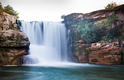 Scenic view of waterfall in forest