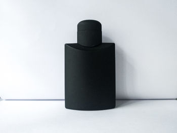 Close-up of paper on table against white background