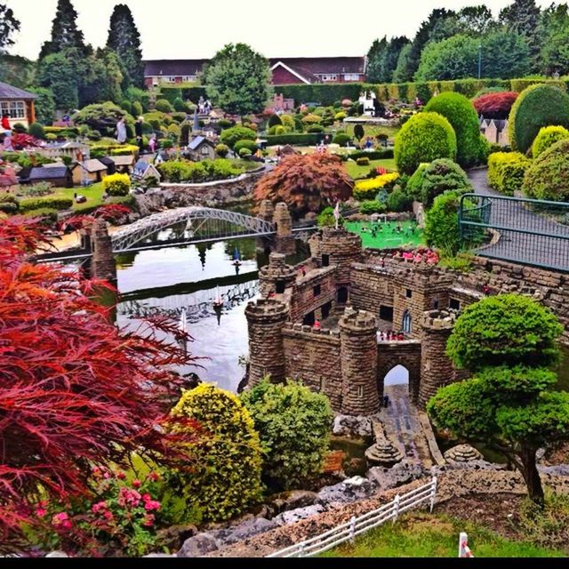 architecture, built structure, building exterior, flower, tree, growth, plant, formal garden, freshness, green color, steps, day, travel destinations, incidental people, travel, history, outdoors, nature, house, stone wall