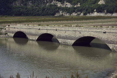 Arch bridge over river