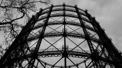 Low angle view of silhouette tower against sky