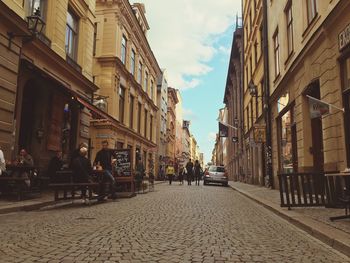 Street in city against sky