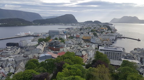 High angle view of town against cloudy sky