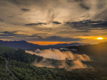 Scenic view of mountains against sky during sunset