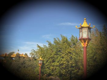 Low angle view of street light against sky