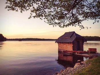 Scenic view of lake against sky during sunset