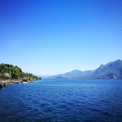 Scenic view of sea against clear blue sky