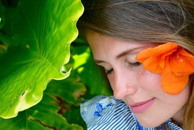 Close-up portrait of woman with flowers