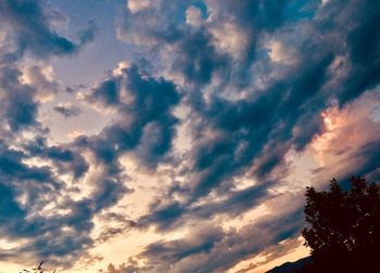 Low angle view of dramatic sky during sunset