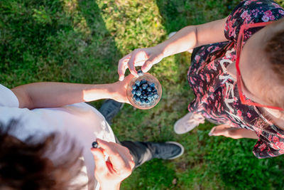 High angle view of couple holding hands