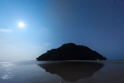 Scenic view of sea against sky at night