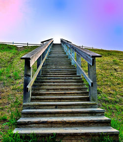 Low angle view of staircase on field against clear sky
