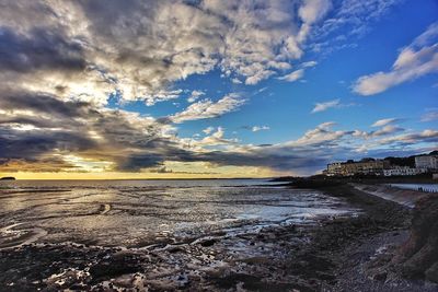 Scenic view of sea against cloudy sky