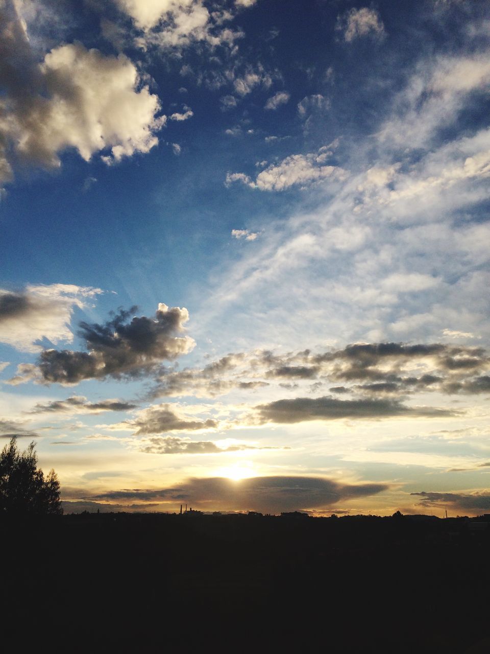 SILHOUETTE OF LANDSCAPE AT SUNSET