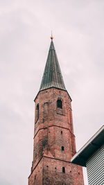 Low angle view of bell tower against sky