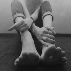 Low section of woman sitting on floor