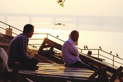 2 men taking air early in the morning in prayagraj 