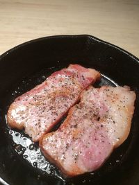 High angle view of meat in pan on table