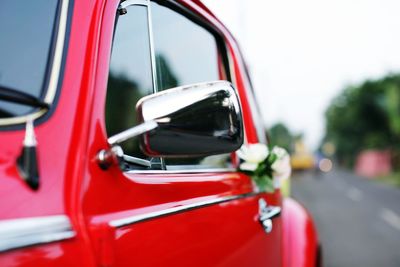 Close-up of red vintage car