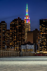 Illuminated buildings in city at night