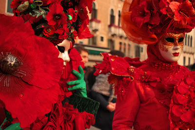 Venice carnival, italy.  rear view of red venetian mask