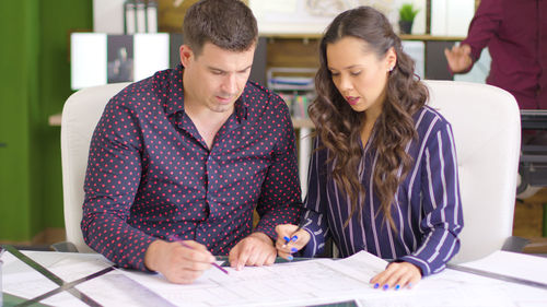 Business colleagues working at table