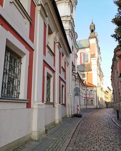 Street amidst buildings in city against sky