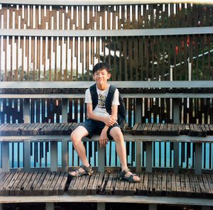 Portrait of smiling young man sitting on seat