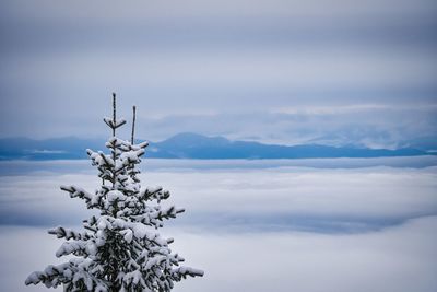Scenic view of snow covered mountains against sky