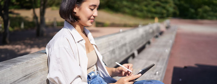 Young woman using mobile phone