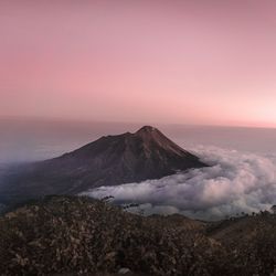 View of volcanic mountain during sunset