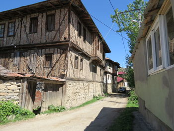 Street amidst buildings against sky