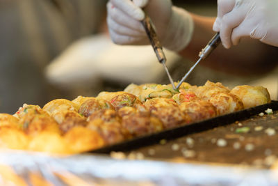Close-up of man preparing food