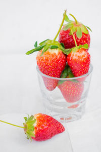 Close-up of strawberries in glass on table