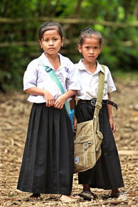 Portrait of cute girl standing outdoors