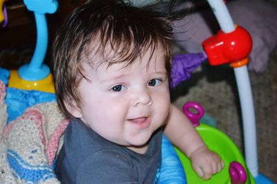 Portrait of cute baby girl with toy