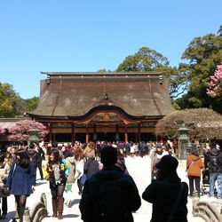 Group of people in front of temple against clear sky