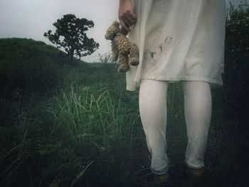 Girl holding teddy bear