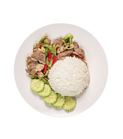 High angle view of food in plate against white background