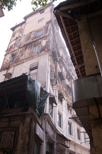 Low angle view of old building against sky