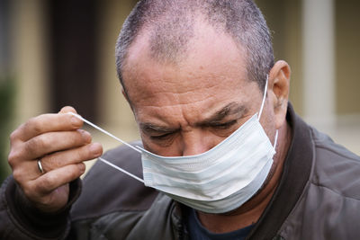 Close-up portrait of a man wearing mask